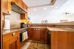 Full kitchen with dish washer and breakfast bar
